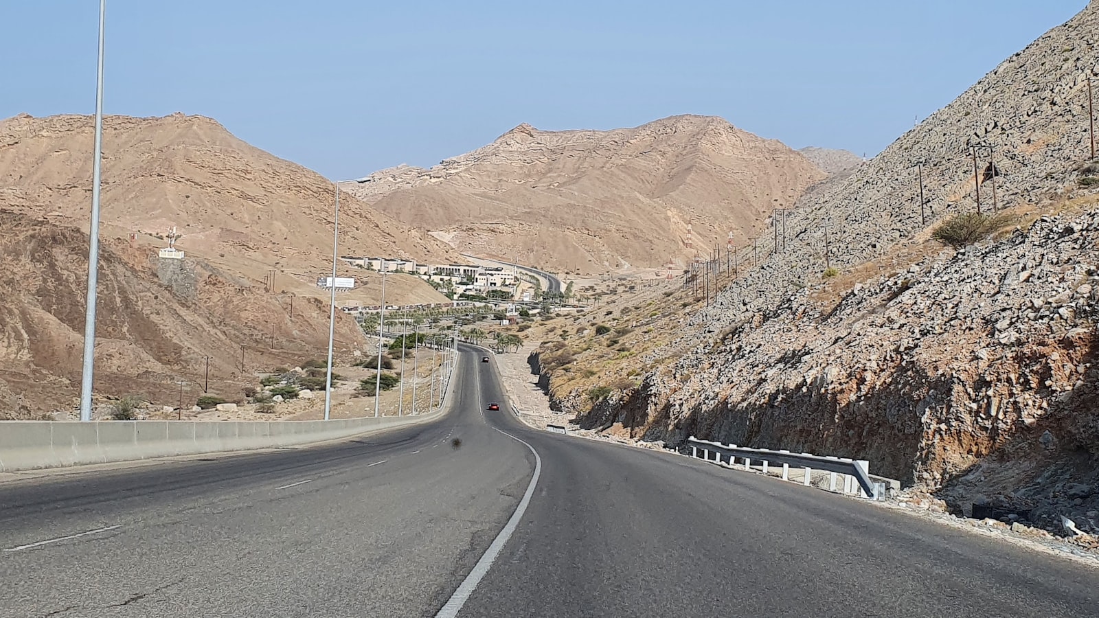 Muscat in Oman with the harbour and mountains behind the city